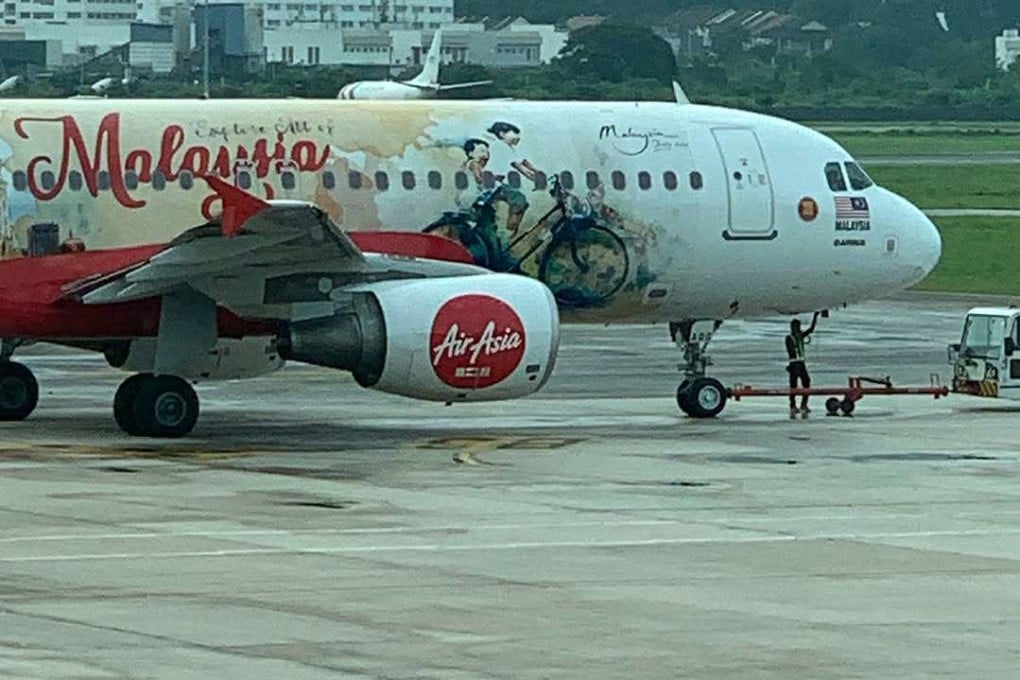 An AirAsia aircraft featuring Ernest Zacharevic’s artwork. Photo: Instagram/ernestzacharevic