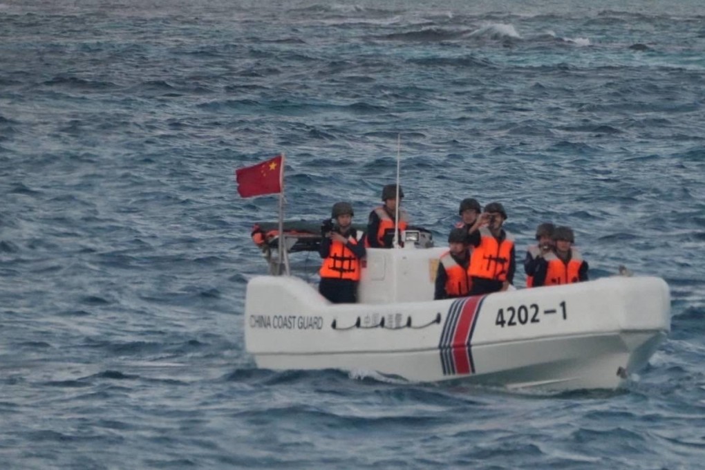 Chinese coastguard officers check an incident with the Philippine fisheries bureau during a survey in the South China Sea on January 24. Photo: PCG/AFP