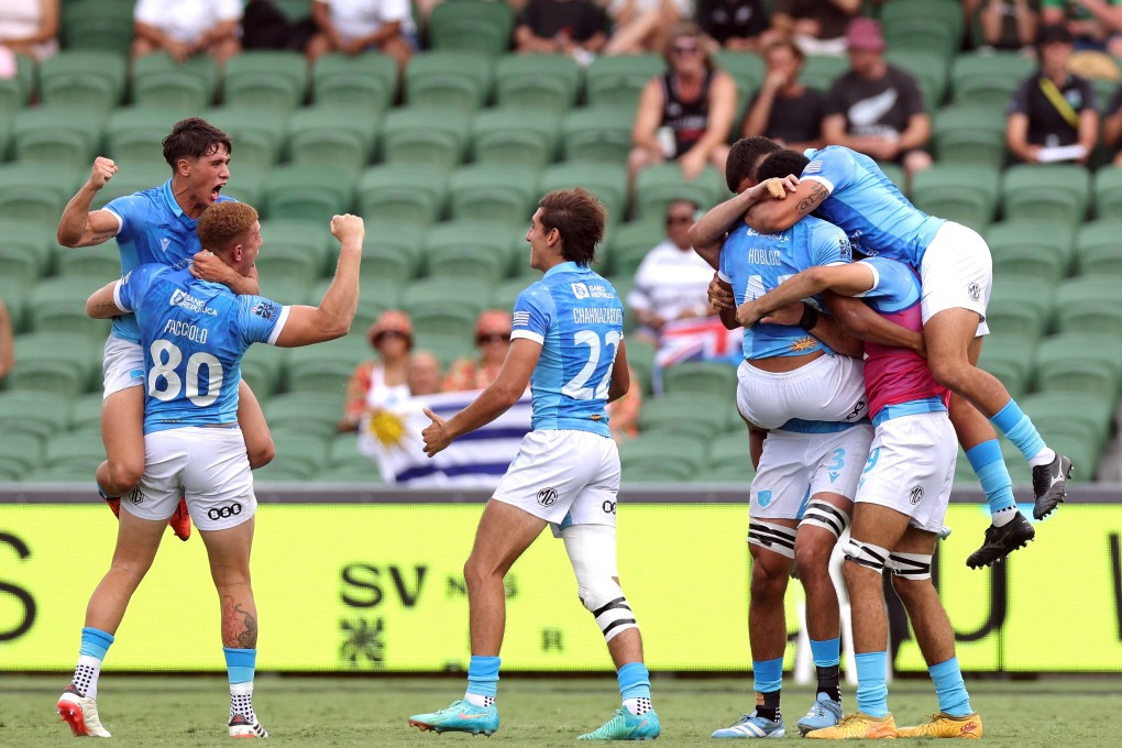 Uruguay players celebrate after beating the All Blacks on the opening day of the World Sevens Series stop in Perth. Photo: Reuters