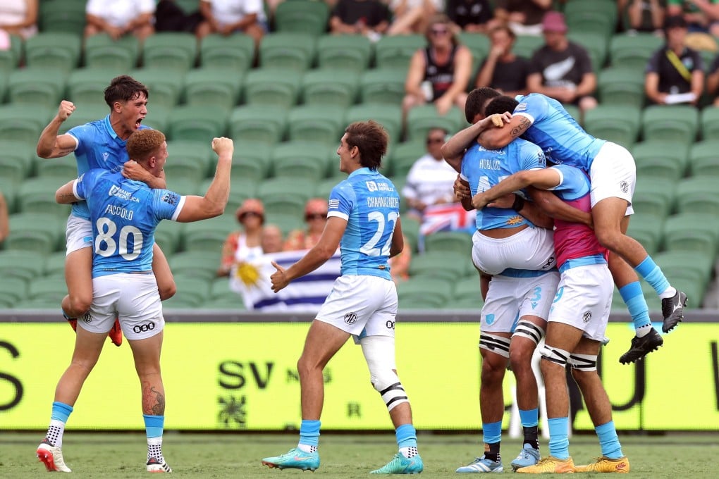 Uruguay players celebrate after beating the All Blacks on the opening day of the World Sevens Series stop in Perth. Photo: Reuters