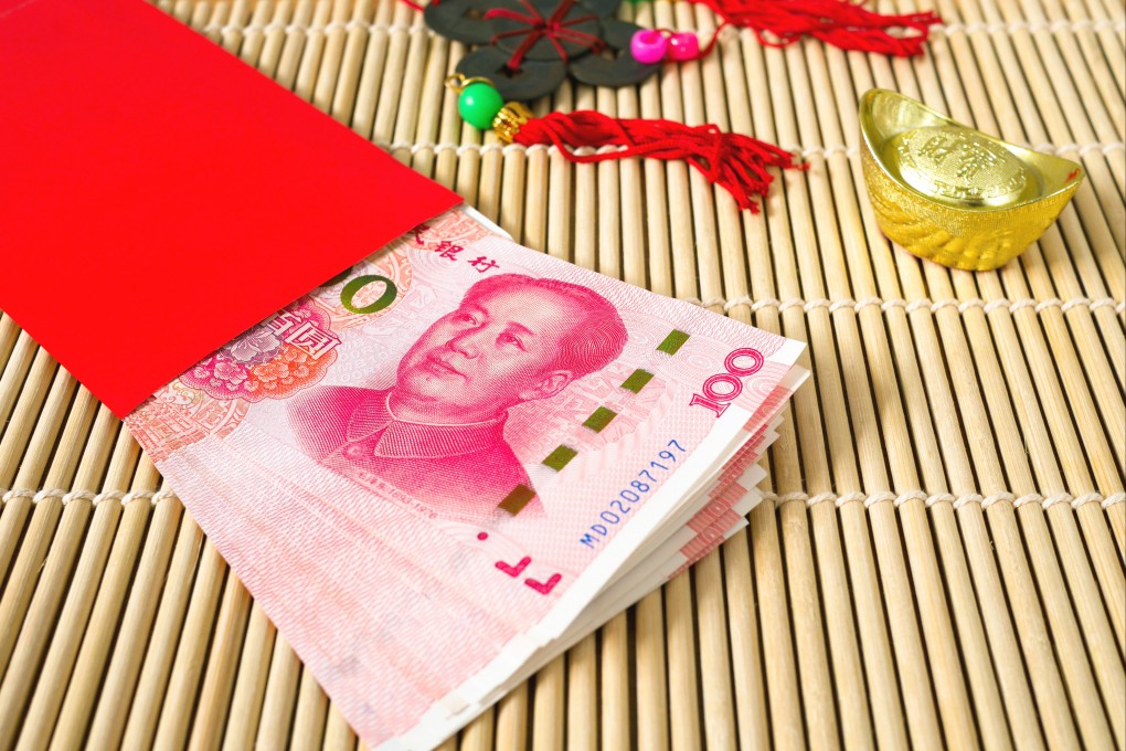 It is a Lunar New Year tradition among Chinese to give out “red packets”, or red paper envelopes containing money. Digital red packets became a popular way for people to send blessings after WeChat launched the function in 2014. Photo: Shutterstock