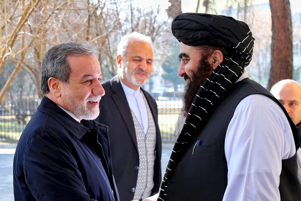 Afghanistan’s Minister of Foreign Affairs Amir Khan Muttaqi (right) shaking hands with his Iranian counterpart Abbas Araghchi at the foreign ministry in Kabul on Sunday. Photo: AFP