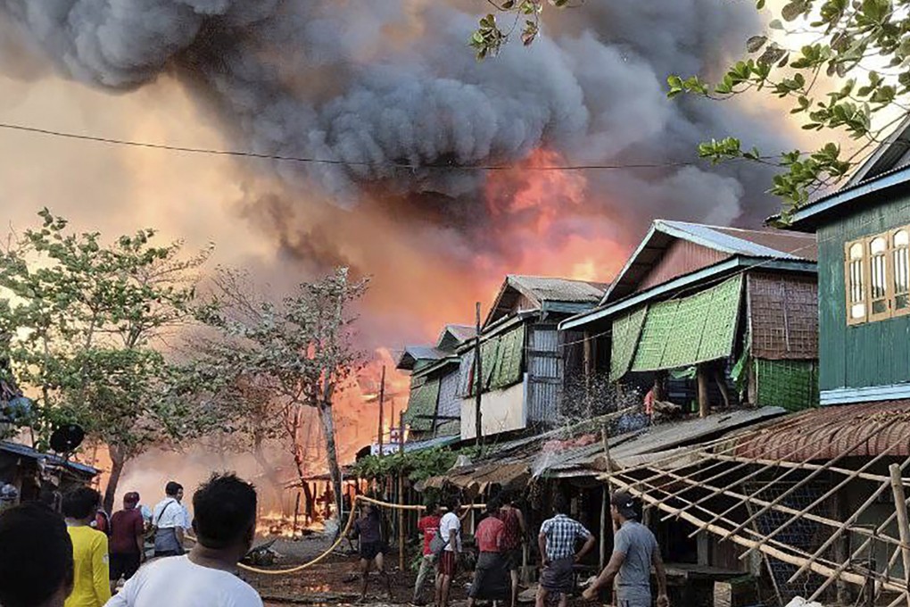 Houses burn on January 8 in a township in Myanmar’s Rakhine state after a suspected junta airstrike. Photo: Arakan Army via AP