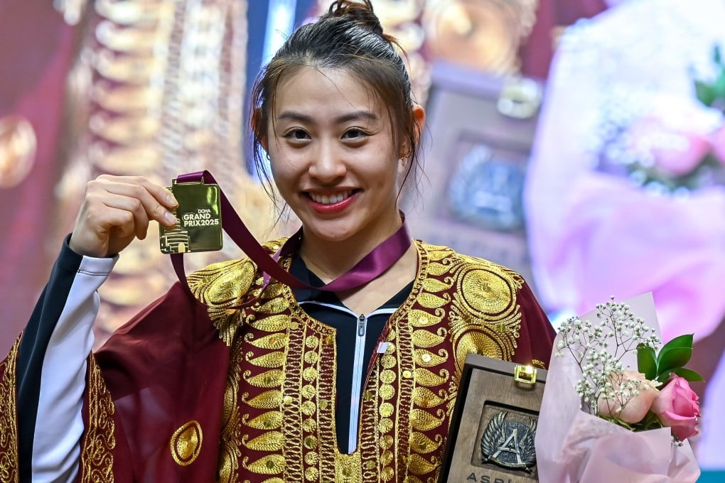 Kaylin Hsieh donning a local Qatari traditional outfit after being awarded her gold medal. Photo: Getty Images