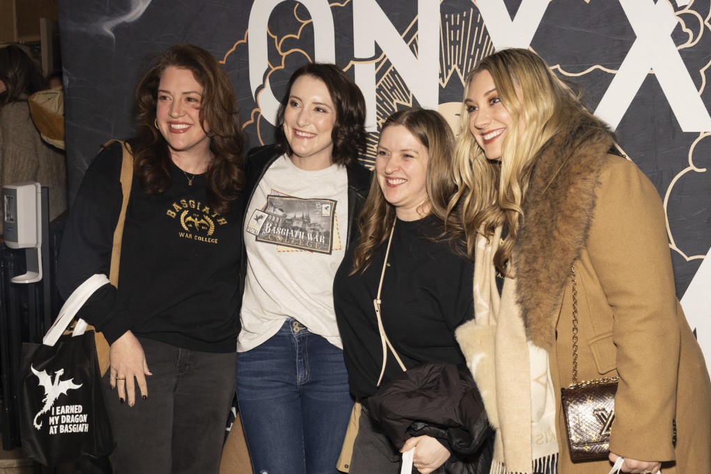 Rebecca Yarros (right) takes photos with audience members who attended a fan event at The Town Hall in Manhattan, New York, about Yarros’ new book Onyx Storm, on January 24, 2025. Photo: CJ Rivera/Invision/AP