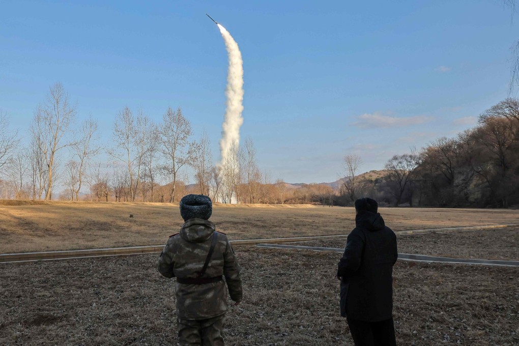 North Korean leader Kim Jong-un (right) oversees the test-firing from underwater of a strategic cruise and guided weapon at an undisclosed location in a photograph released by state media on Sunday. Photo: KCNA via KNS/AFP