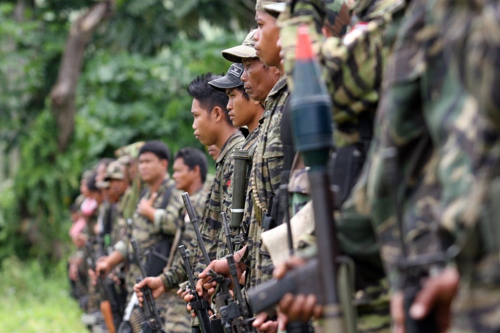 Former rebels belonging to Moro Islamic Liberation Front are seen inside a camp in Sultan Kudarat, Mindanao. Photo: Jeoffrey Maitem