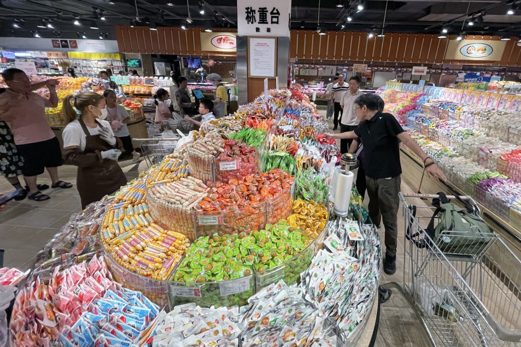 Customers buy snacks at Pangdonglai Times Square in Xuchang, China’s Henan province, on July 1, 2023. Photo: Simon Song