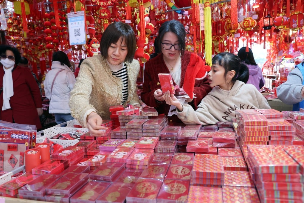 Shoppers select red packets at a market in Shenzhen on January 16. Photo: Edmond So