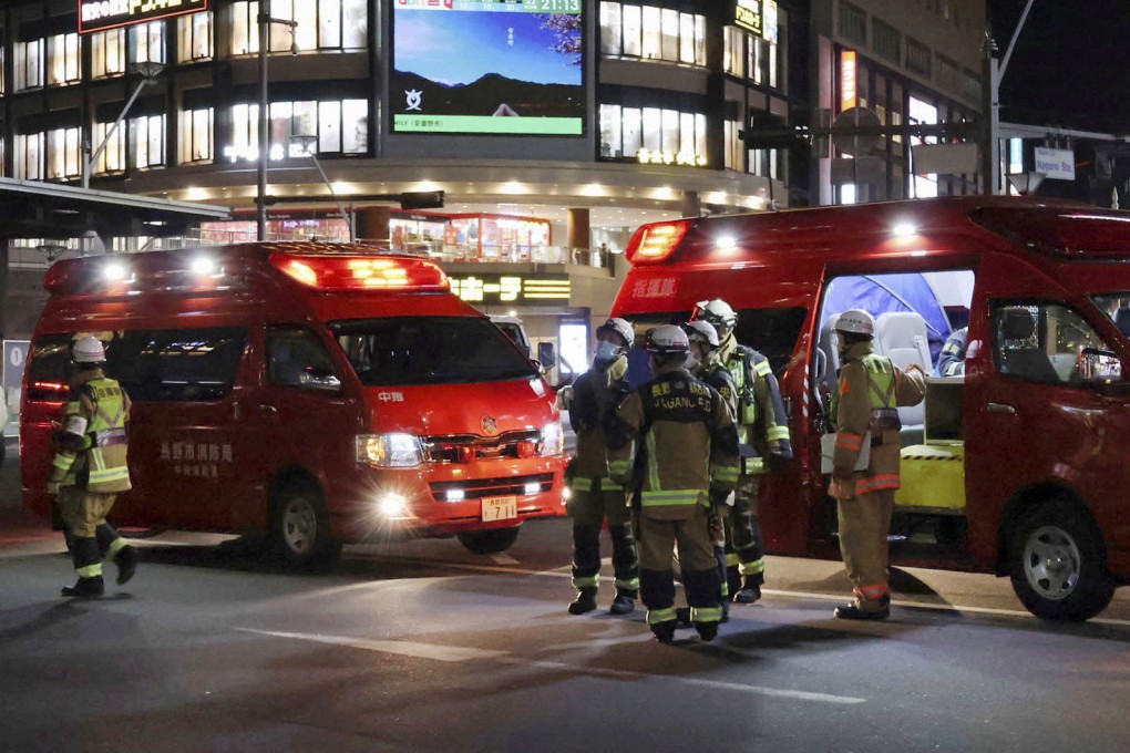 Paramedics stand at the site where multiple people were stabbed in front of JR Nagano Station in Nagano, central Japan, on January 22, 2025. Kyodo/Reuters