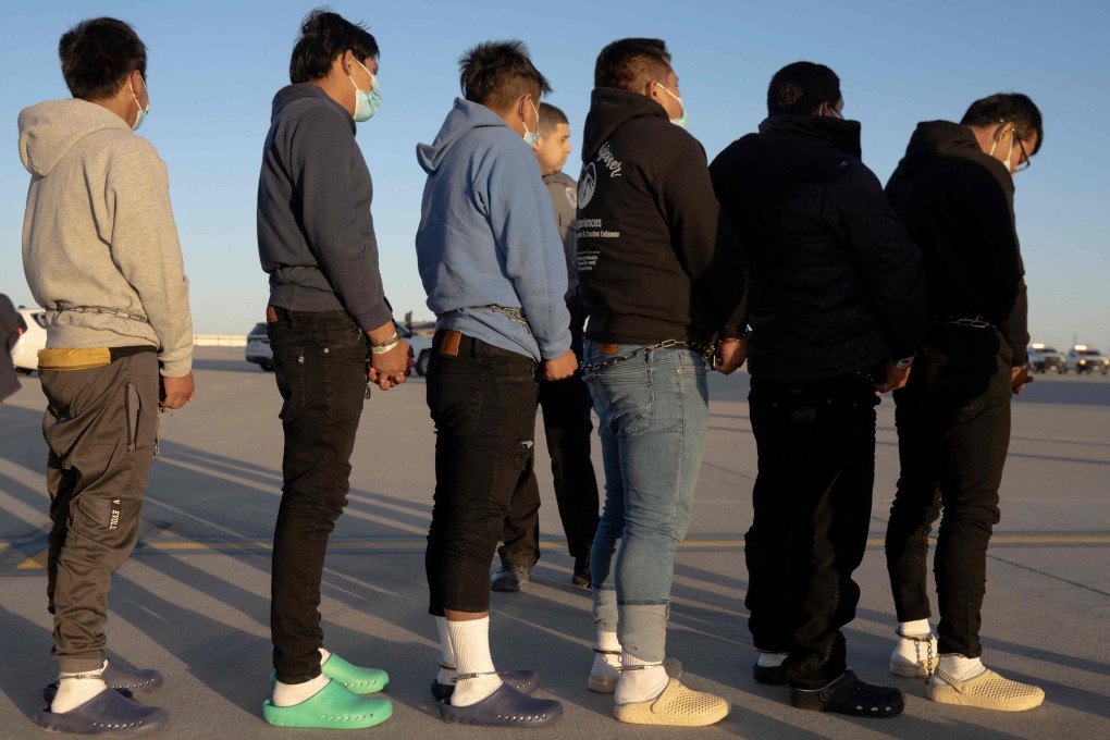 This image released by the Pentagon shows shackled undocumented migrants preparing to board a C-17 Globemaster III assigned to the 60th Air Mobility Wing for a removal flight at Fort Bliss, Texas, on Thursday. Photo: Department of Defence via AFP