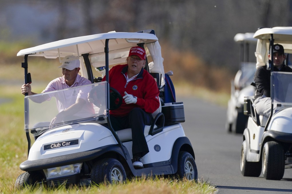 President Donald Trump gets out of a golf cart at a course in Virginia, US. His administration plans to hike tariffs on made-in-China carts by more than 450 per cent. Photo: AP