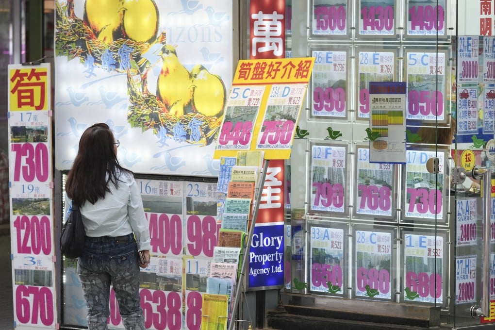 Homes for sale are listed on a property agency in South Horizons. Photo: Eugene Lee