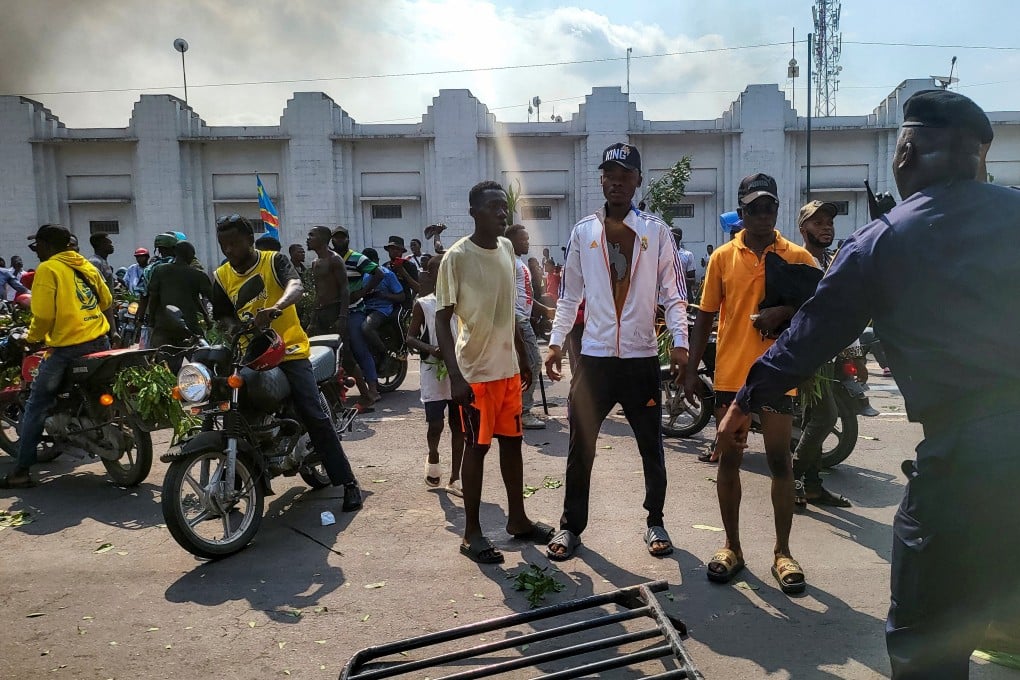 Protesters clash with riot police forces in front of the French Embassy in Kinshasa. Photo: Reuters