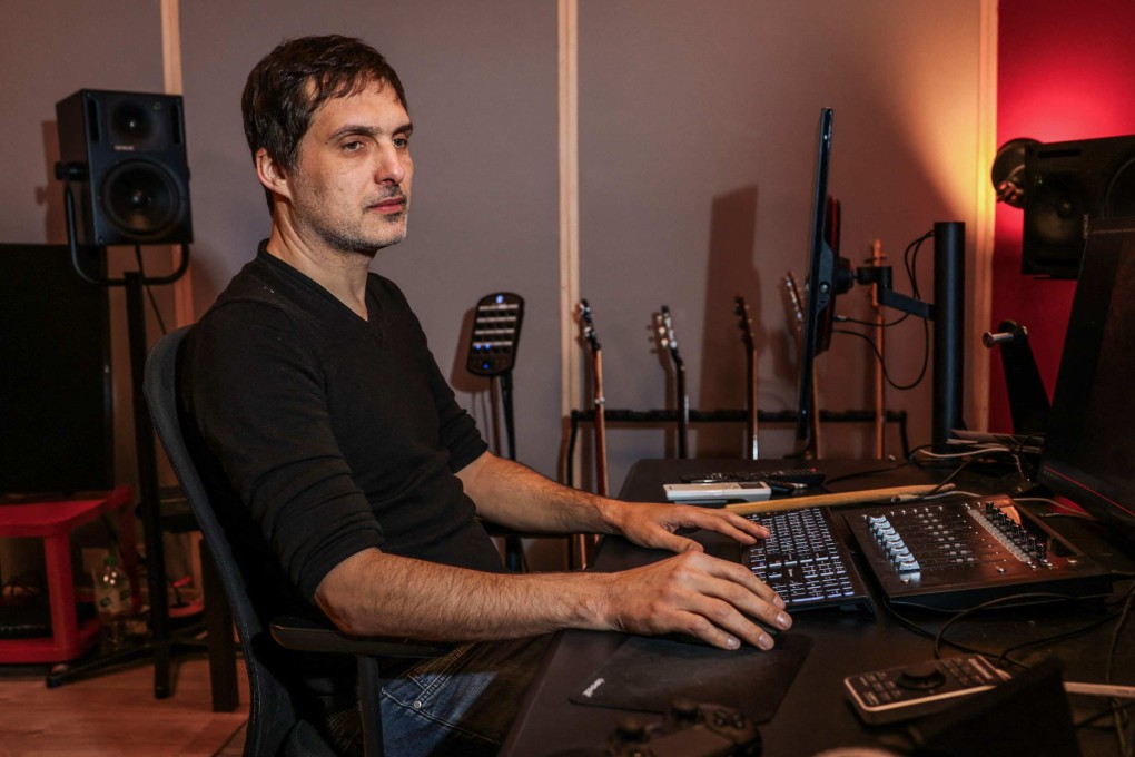 French video game music composer Olivier Deriviere, who has worked on games including Assassin’s Creed IV,  A Plague Tale: Innocence, Streets of Rage 4 and Dying Light 2 Stay Human, works in his recording studio in Malakoff, on the outskirts of Paris, on January 14, 2025. Photo: AFP