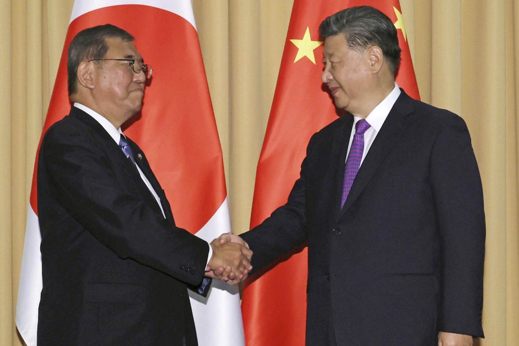 Japanese Prime Minister Shigeru Ishiba shakes hands with Chinese President Xi Jinping on the sidelines of the Asia-Pacific Economic Cooperation Forum in Lima, Peru last year. Photo: Kyodo