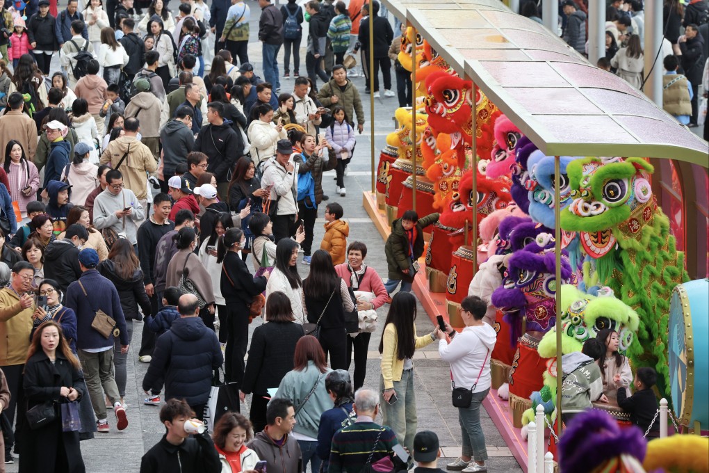 Tourists and locals enjoy the festive decorations in Tsim Sha Tsui.  Photo: Dickson Lee