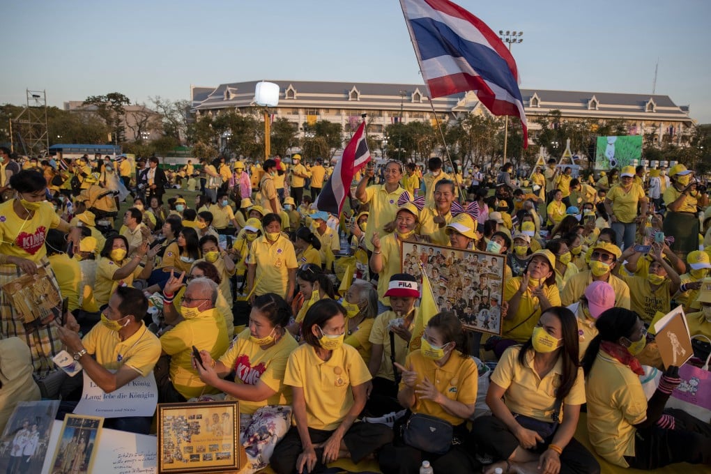 Supporters of Thai monarchy display images of King Maha Vajiralongkorn, Queen Suthida and the late King Bhumibol Adulyadej during an event in December 2020. Thailand’s monarchy is protected from criticism by a lese-majeste law. Photo: AP