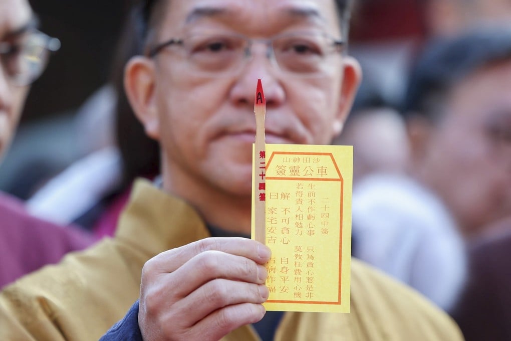 A rural chief has drawn the No 24 “neutral” fortune stick. Photo: Dickson Lee