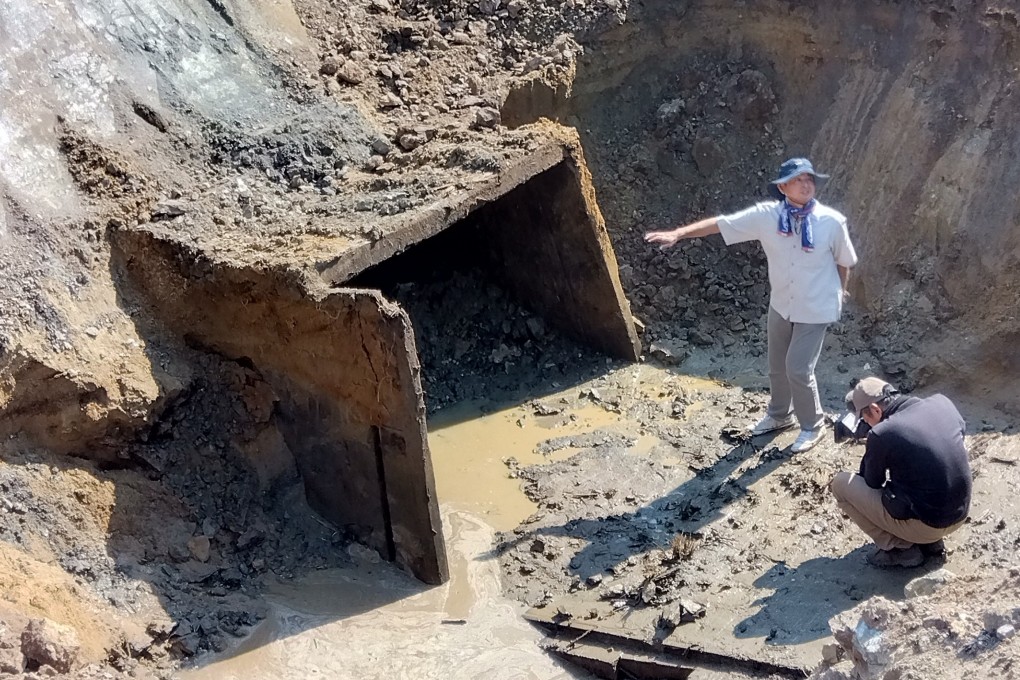 Researchers study the entrance to Chosei mine. Photo: Association to Engrave the Flooding Disaster of Chosei Coal Mine into History