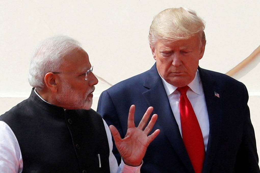 US President Donald Trump and India’s Prime Minister Narendra Modi talk as they arrive for a joint news conference at Hyderabad House in New Delhi, India, on February 25, 2020. Photo: Reuters