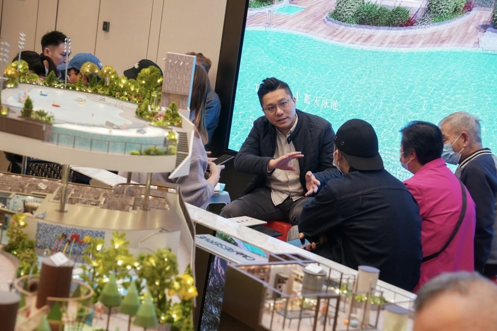 Property agents and potential buyers at the sales office of The Reserve on Saturday. Photo: Elson Li