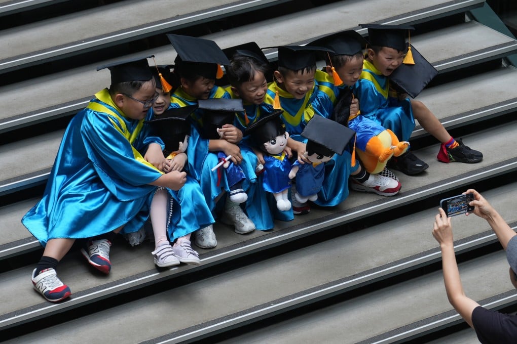 Kindergarten children pose for pictures at The Mills in Tsuen Wan. Photo: Sam Tsang