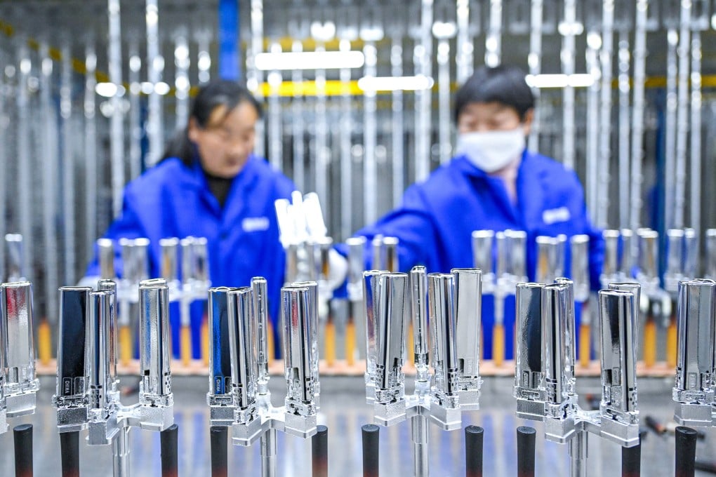 Employees work at a lighter parts factory in Shangqiu, Henan Province. The region in central China has launched a campaign to shore up confidence in the private sector amid a period of economic uncertainty. Photo: Xinhua