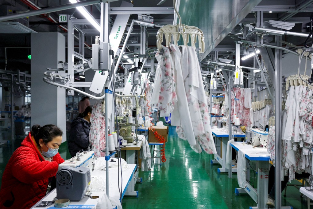 Employees work on the production line of a lingerie factory in eastern China’s Jiangsu province. Growth in China’s manufacturing sector unexpectedly slowed in January, according to a new report. Photo: Reuters