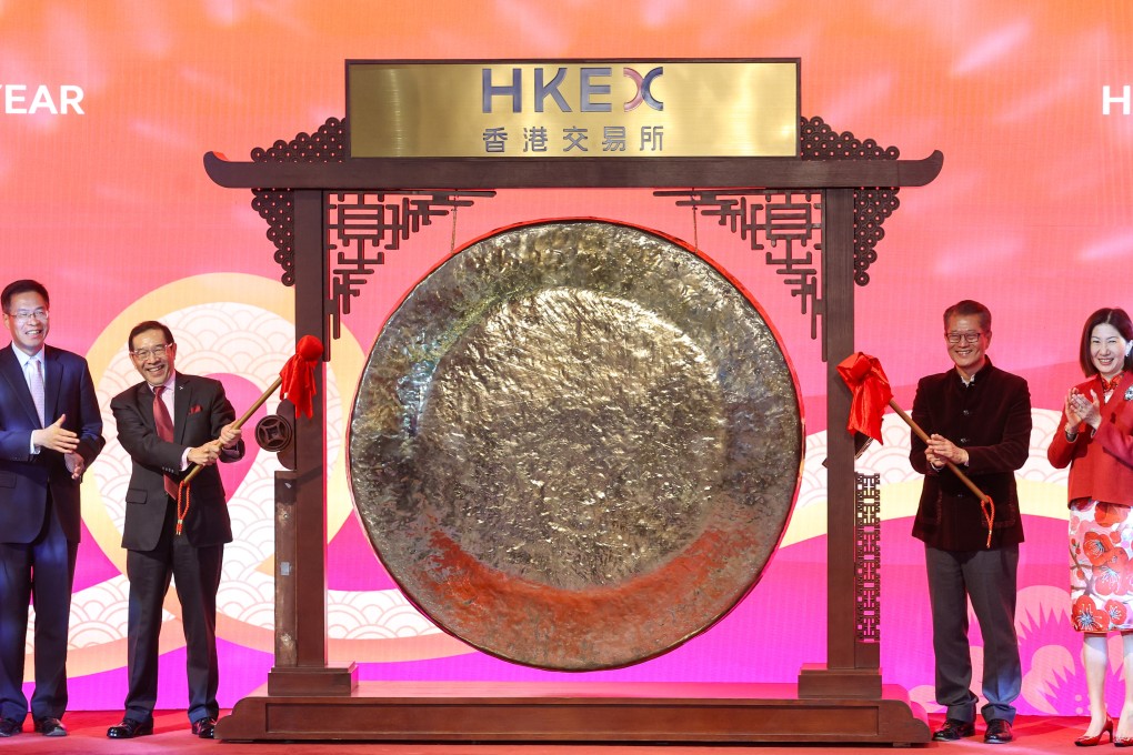 (From left)Central government liaison office deputy Qi Bin, HKEX chairman Carlson Tong, Financial Secretary Paul Chan, and HKEX CEO Bonnie Chan attend the Lunar New Year ceremony at the Hong Kong stock exchange on Monday. Photo: Edmond So
