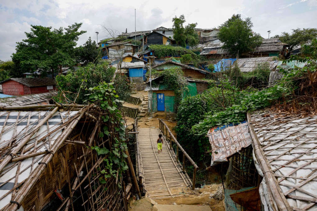A Rohingya child walks on the bridge made from bamboo at a refugee camp, in Cox’s Bazar, Bangladesh, on September 30, 2024. The camp is just one that benefits greatly from global aid. Photo: Reuters
