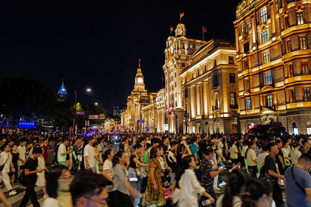Tourists crowd the Bund in central Shanghai. China saw a surge in inbound tourism during the Lunar New Year holiday. Photo: Xinhua