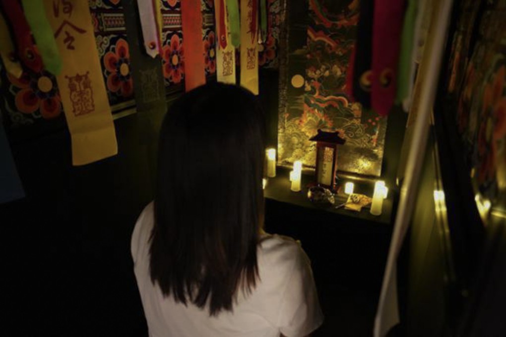 A woman interacts with an AI shaman called ShamAIn - an artificial-intelligence fortune-telling system - at Ground Seoul, a gallery in Insa-dong, Seoul, South Korea, in January. Photo: Kaist