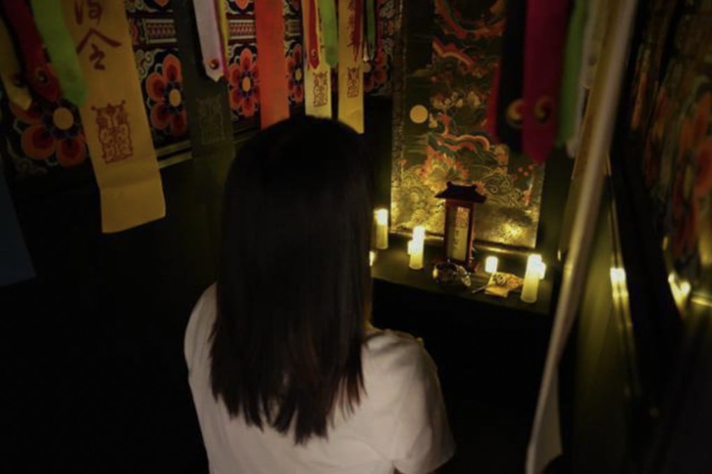 A woman interacts with an AI shaman called ShamAIn - an artificial-intelligence fortune-telling system - at Ground Seoul, a gallery in Insa-dong, Seoul, South Korea, in January. Photo: Kaist