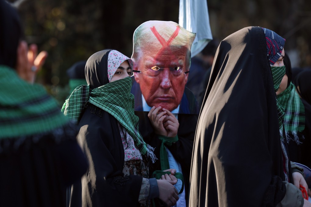 Members of Iran’s female paramilitary force hold a cartoon of Donald Trump during an anti-Israel rally in Tehran in January. Photo: EPA-EFE