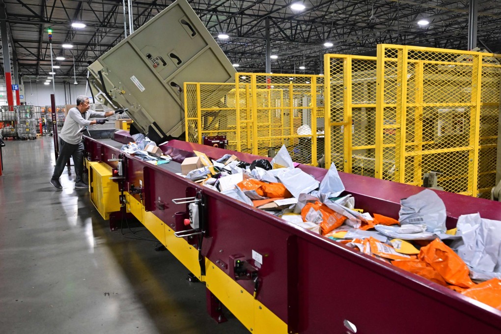 A US Postal Service employee sorts mail at a processing and distribution centre in Los Angeles. Photo: AFP