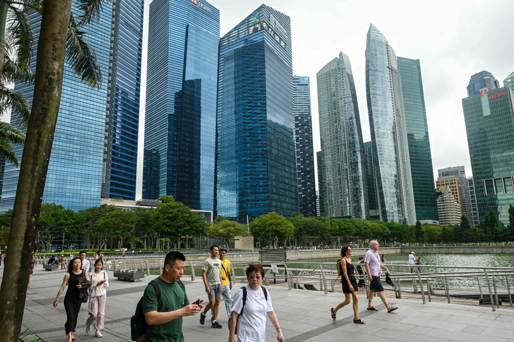 People walk along the promenade at Marina Bay in Singapore. Photo: AFP