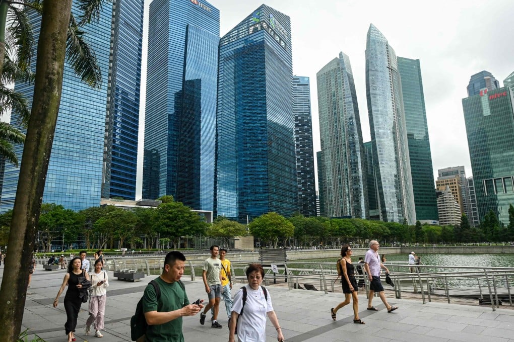 People walk along the promenade at Marina Bay in Singapore. Photo: AFP