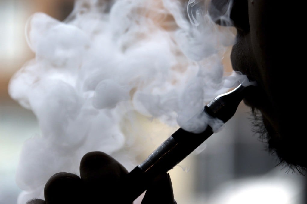 A man smokes an electronic cigarette. Photo: AP