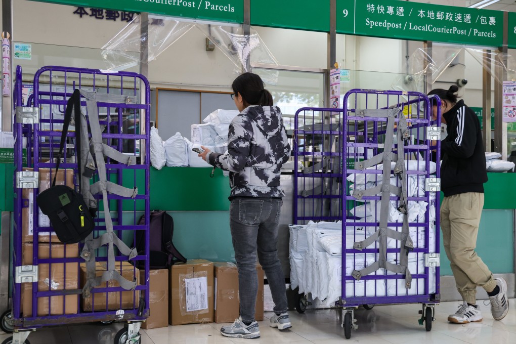 Residents mail parcels at Hong Kong’s General Post Office in Central. Commerce chief Algernon Yau has dismissed the idea of retaliatory measures against the US. Photo: Jelly Tse