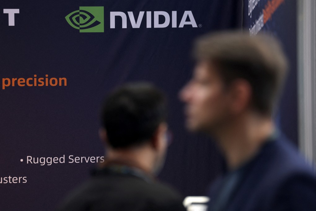 Attendees walk past a banner showing Nvidia branding, during the AI & Big Data Expo in London, February 5, 2025. Photo: Reuters