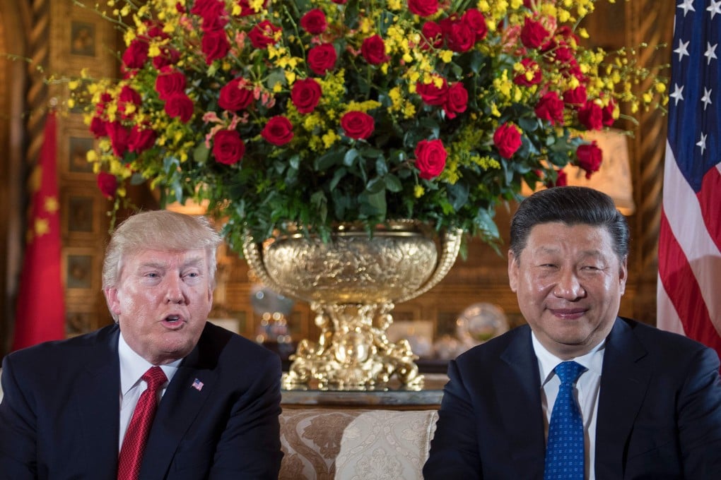 Donald Trump sits with Chinese President Xi Jinping in 2017. Photo: AFP