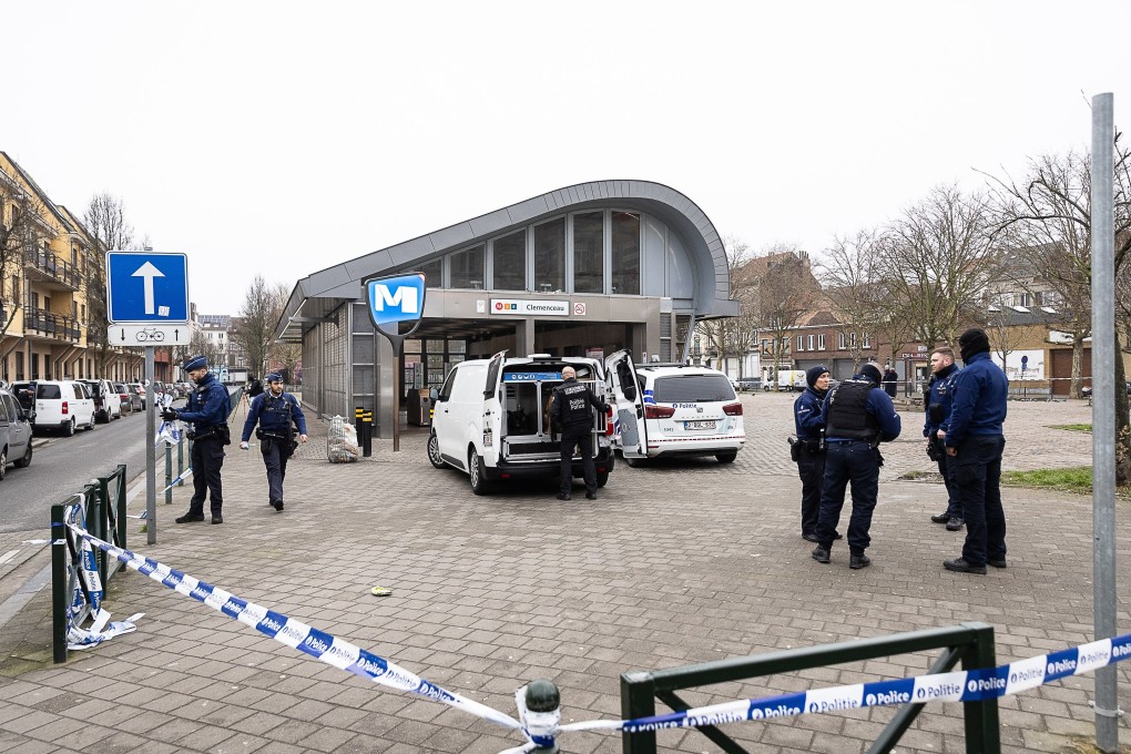 Security officers stand outside the Delacroix metro station, which is closed off after a shooting this morning. Police are chasing two suspects who fled into Brussels· metro tunnels following a shooting in the Belgian capital. Photo: Jdpa