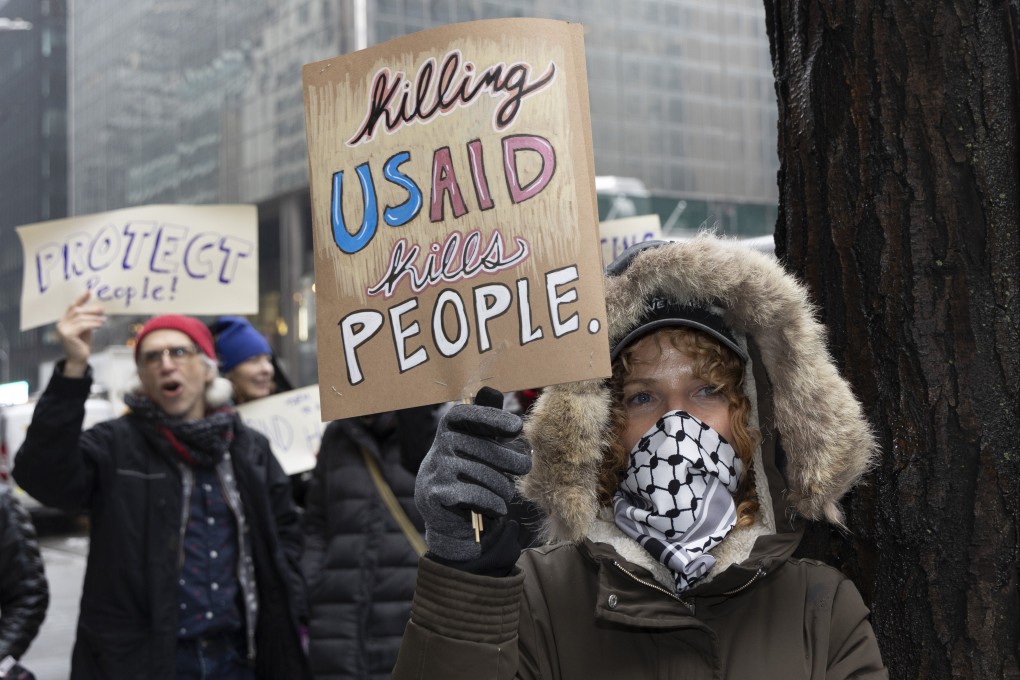 A demonstrator holds a sign during a New York protest on Thursday against policies of US President Donald Trump. Photo: dpa