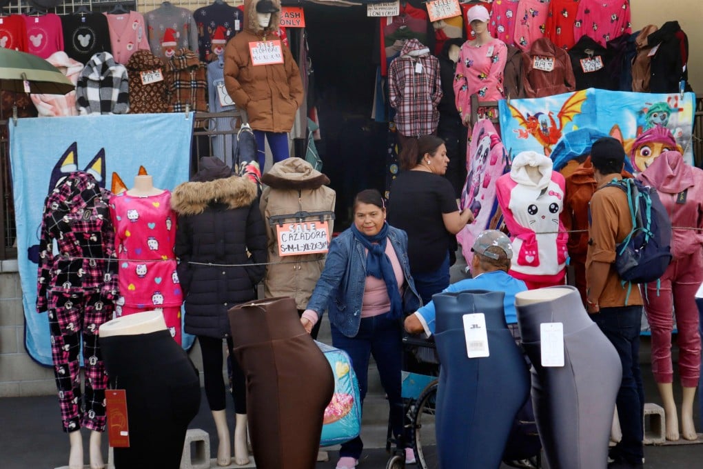 People shop at a discount store near the US-Mexico border in San Ysidro, California, on November 26, 2024. Photo: AFP
