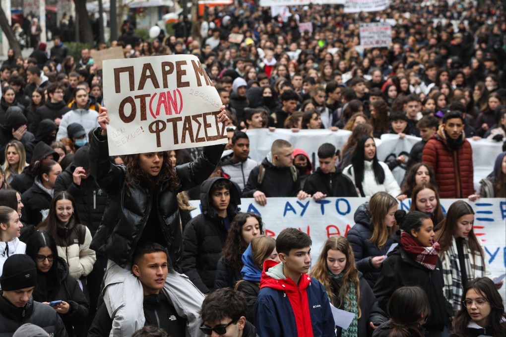 People shout slogans and hold placards during a protest rally in Greece on Friday, demanding justice for the 57 victims of a 2023 train crash. Photo: EPA-EFE