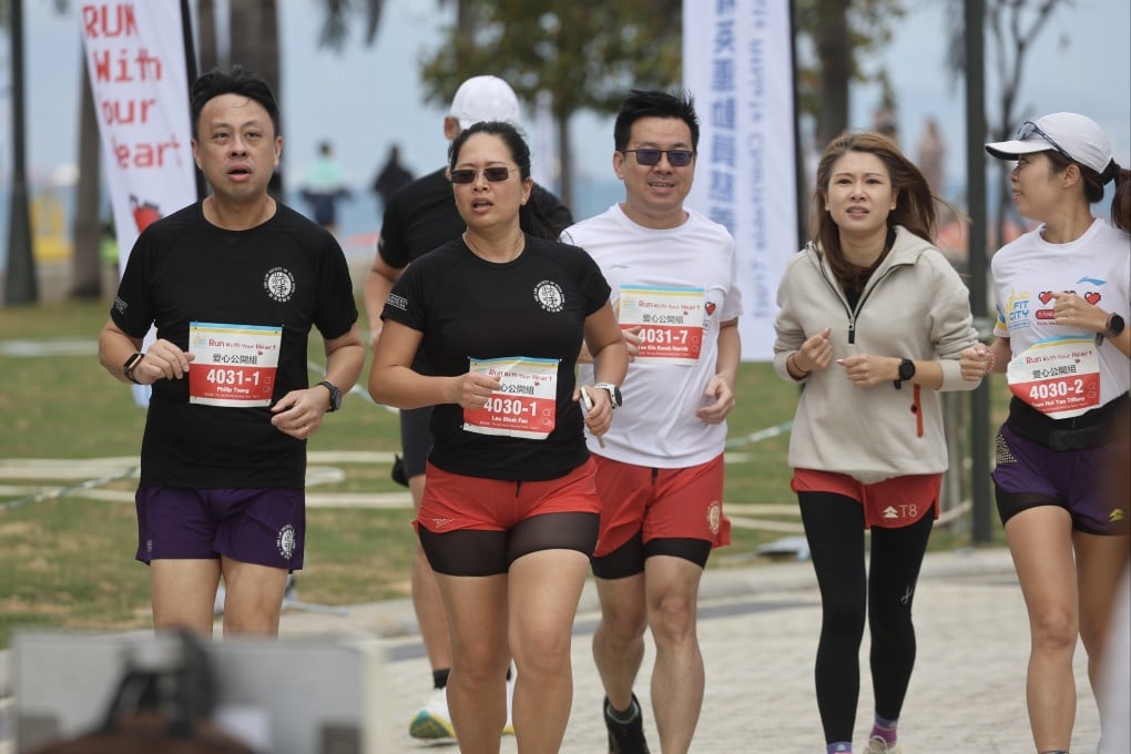 Catherine Lau (second left), a Hong Kong lawyer and avid runner whose participation in the Tokyo Marathon in 2024 completed the Six World Marathon Majors, runs at a Jockey Club Fit City fundraising event. Photo: Edmond So