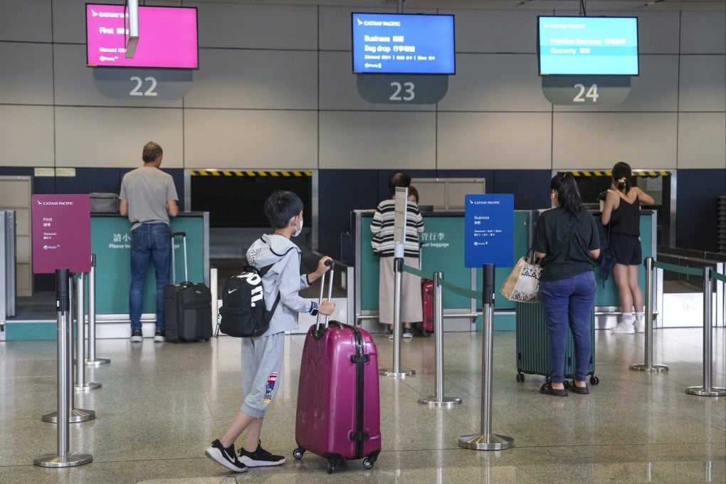 Passengers use the check-in and bag drop-off services at Hong Kong MTR station. Photo: Elson Li