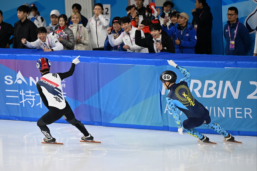 South Korea’s Park Ji-won (left) Kazakhstan’s Adil Galiakhmetov celebrate after the mixed-team 2,000m relay final in Harbin. Photo: Xinhua