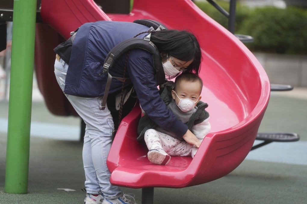 A woman and a child wear masks at a playground. Since the start of the flu season in January, the city has recorded 240 severe cases, with 90 per cent of the adult ones involving people aged 65 and above. Photo: Sam Tsang